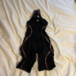 Black Speedo Tech Suit with Gold Accents